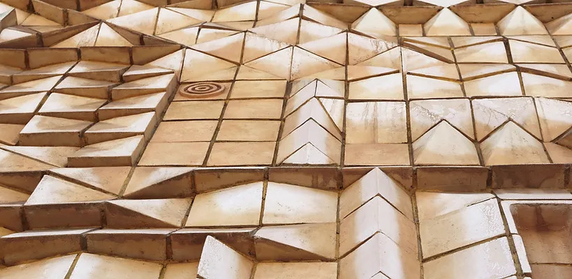 Close-up of a wall with colorful geometric shapes.