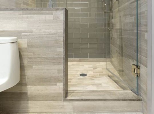A stylish bathroom showcasing a glass shower stall.