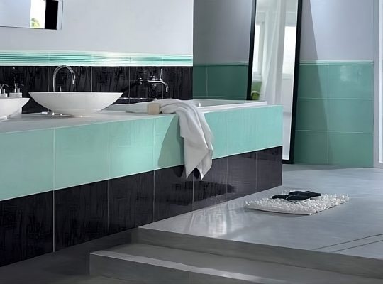 A contemporary bathroom with black and white tiles, showcasing a clean and stylish aesthetic.