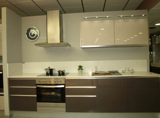 A kitchen with a stove, oven, and sink.